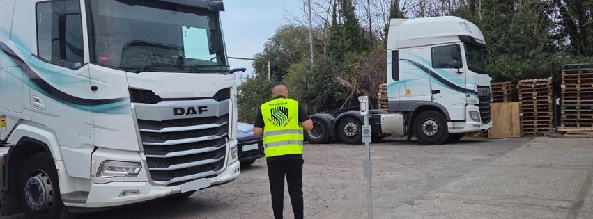 Gatehouse security officer managing HGV vehicle access and site traffic control