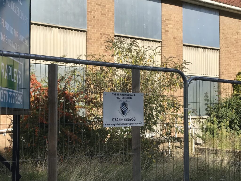 Vacant property protected by MW Global Security with fencing and site security signage